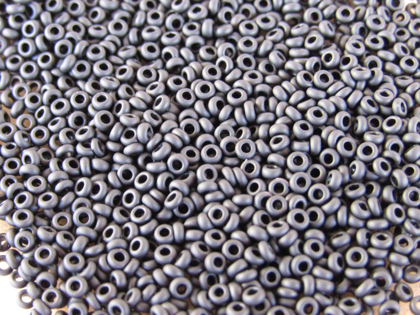 049F - 11/0 Toho Demi Round - Mat Opaque Jet Black