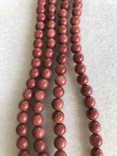 6-7mm Goldstone Smooth Round