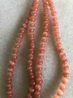 6mm Cat's Eye Glass Orange Smooth Round