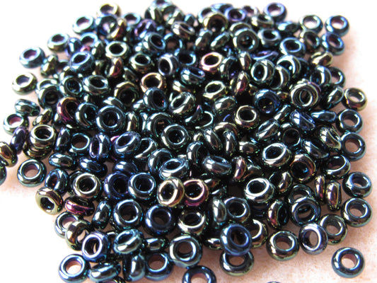 084 - 6/0 Toho Demi Round - Met Iris Green/Brown