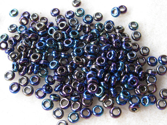 086 - 6/0 Toho Demi Round - Met Rainbow Iris