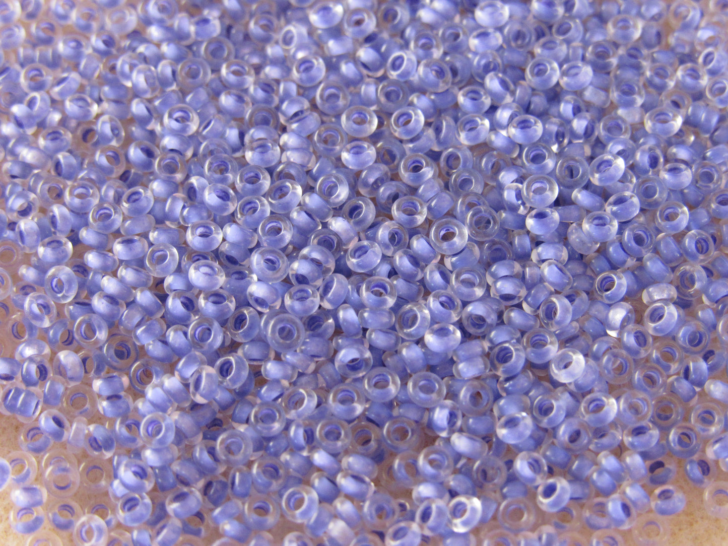 977 - 11/0 Toho Demi Round - Amethyst Lined Crystal
