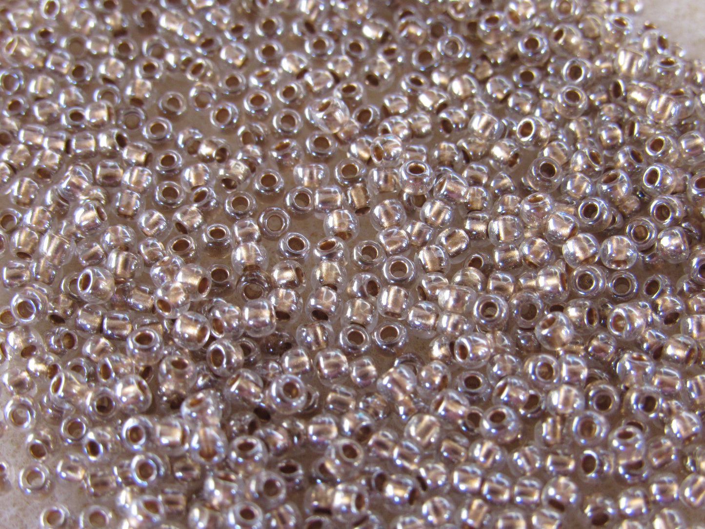 989 - 11/0 Toho Demi Round - Bronze Lined Crystal
